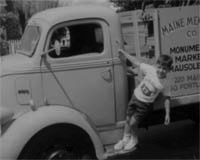 Paul DiMatteo as a child hanging onto the side of a truck